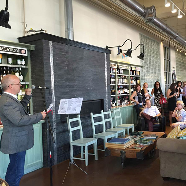man speaking to crowd at event